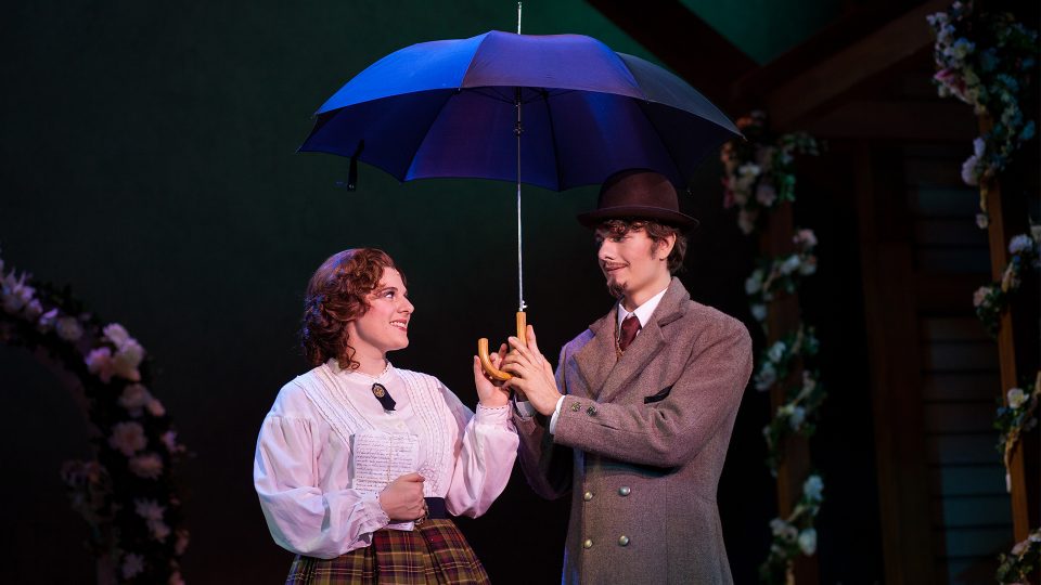women and man under an umbrella