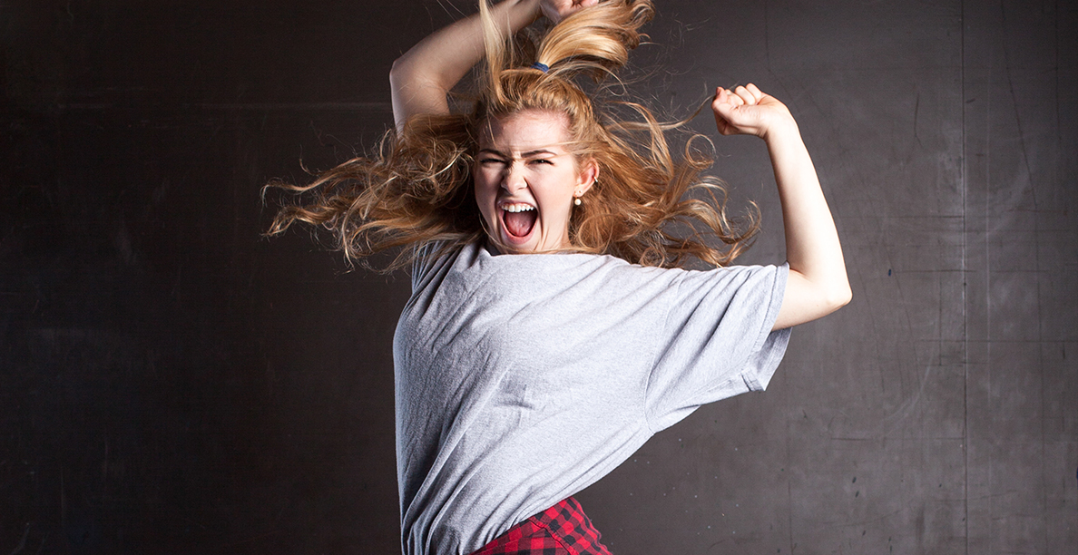 woman with blonde hair jumping