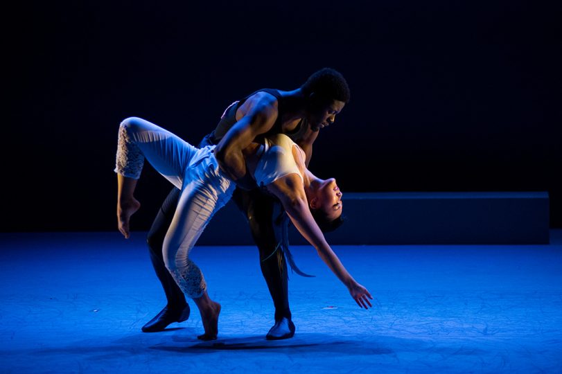 two dancers perform