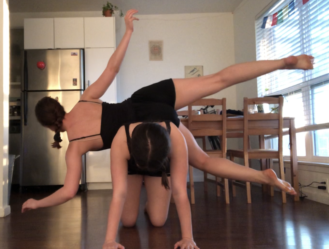 dancers posing in their kitchen
