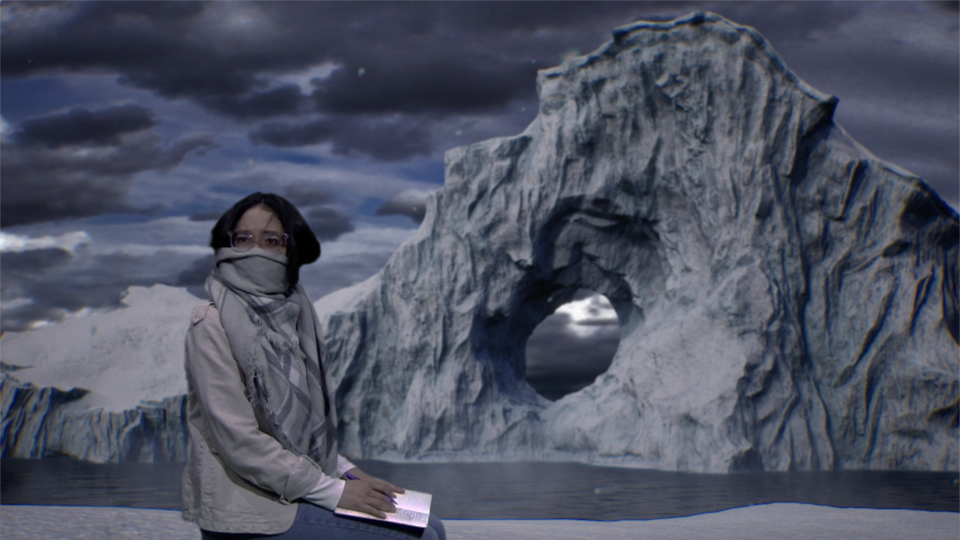 woman sitting in front of an iceberg