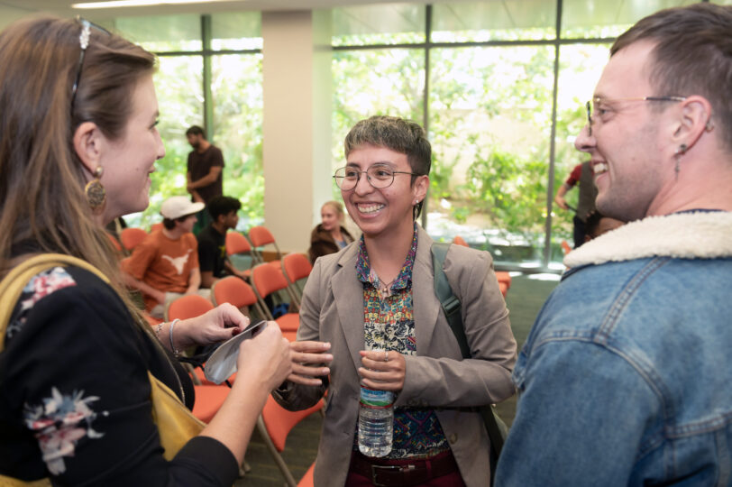 three PPP students talk and laugh together