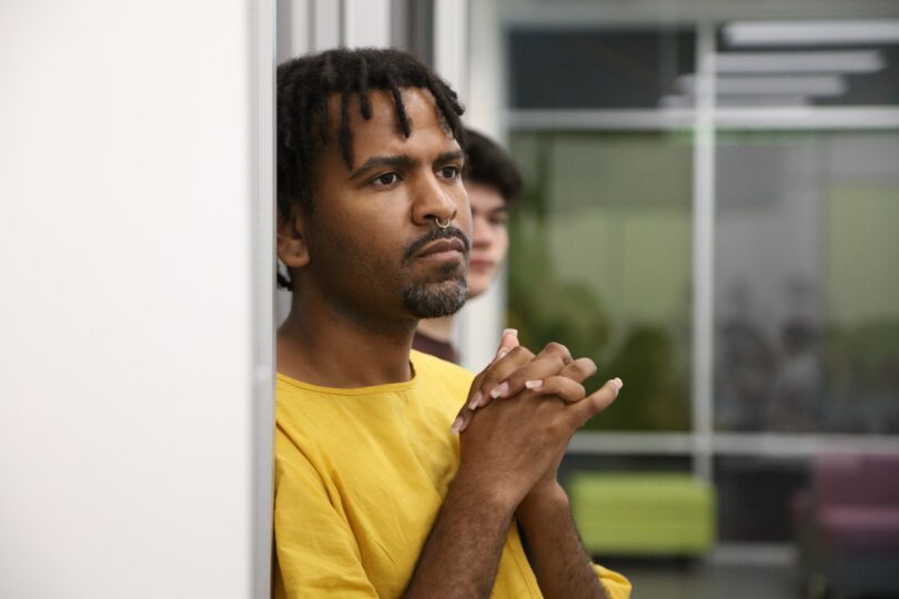 Deen Rawlins-Harris looks forward, deep in thought, during a workshop on climate change and public infrastructure.