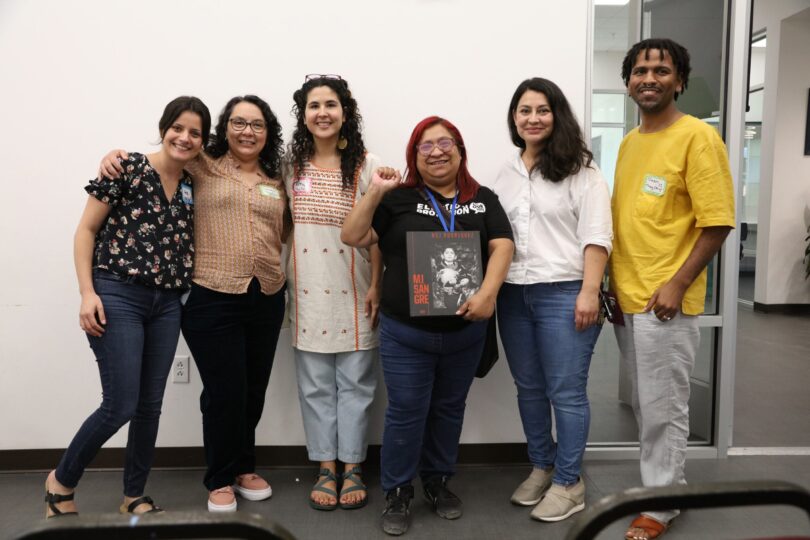 Deen Rawlins-Harris poses with four researchers and a community member