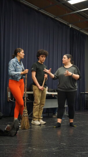 Director Anna Skidis Vargas talks with two actors during rehearsals for ROMEO Y JULIET
