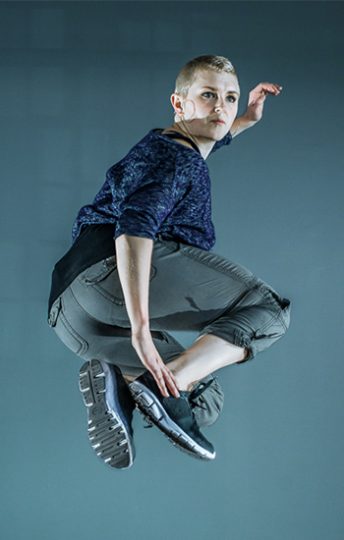 woman jumping in the air and posing