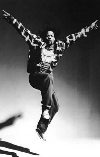 man jumping in the air and posing