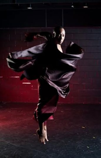 man dancing with flowing outfit