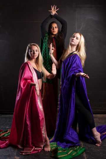 three women in colorful dresses