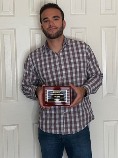 John with his plaque