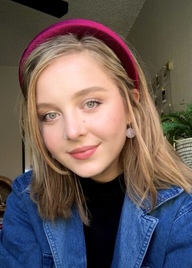 woman with blonde hair and a thick red headband