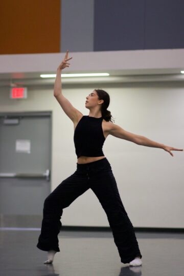 Sole dancer with arm lifted