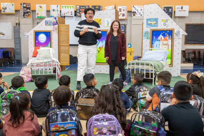 Mateo Hernandez and Roxanne Schroeder-Arce talk to students before the start of THE SMARTEST GIRL IN THE WORLD