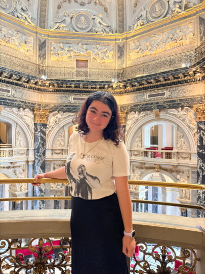 Photo of Faith bouchelle in front of a a palacial interior in Vienna