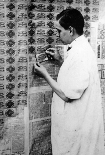 Man using currency as wallpaper in germany in the 20s