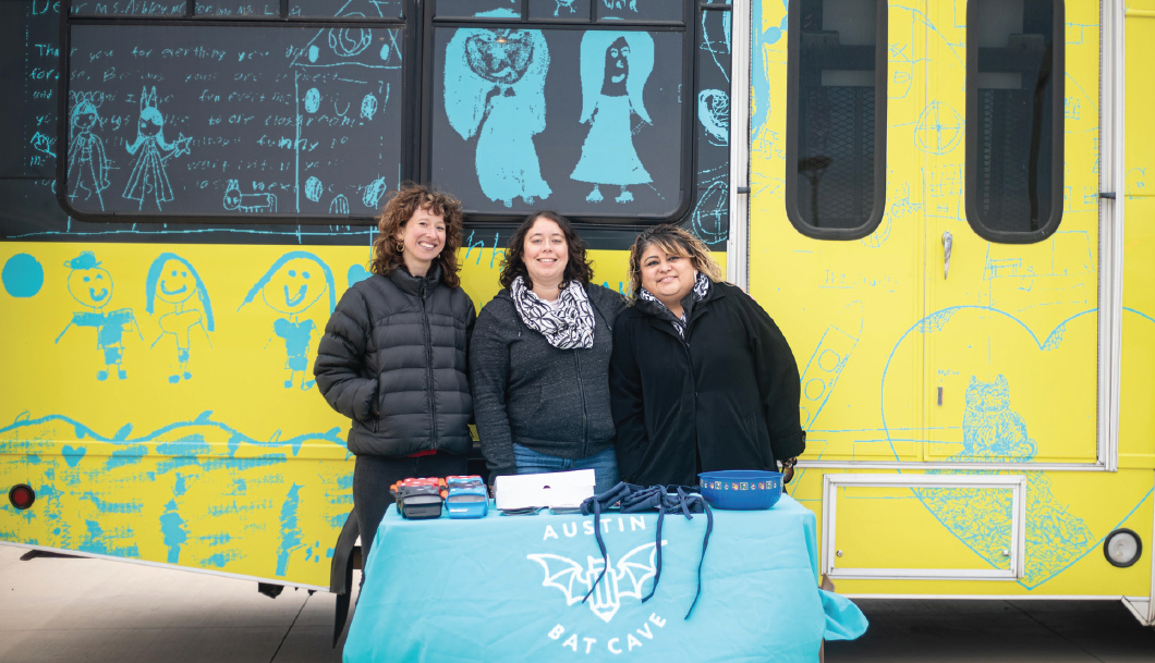 Heather Jones (left), ABC regional program manager Leticia Urieta (middle) and LEAD Coordinator Maria Allen (right) pose for a photo in front of the Bat Mobile at Del Valle High School on Oct. 11, 2019. Urieta organizes and runs the Bat Mobile program.