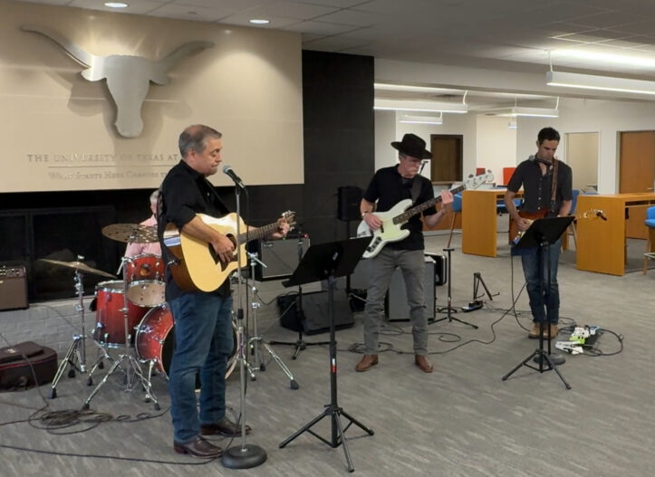 Dean Cole plays bass guitar with Dean's List - a band composed of UT deans - during a gathering of UT Austin leadership at Walter Webb Hall.