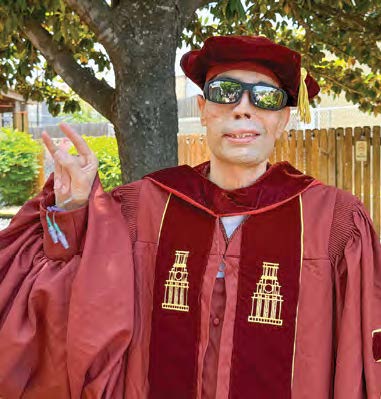 IMAGE CAPTION (p. 23, bottom right): Dr. Qusay Hussein in doctoral regalia (cap and gown), smiling outdoors.