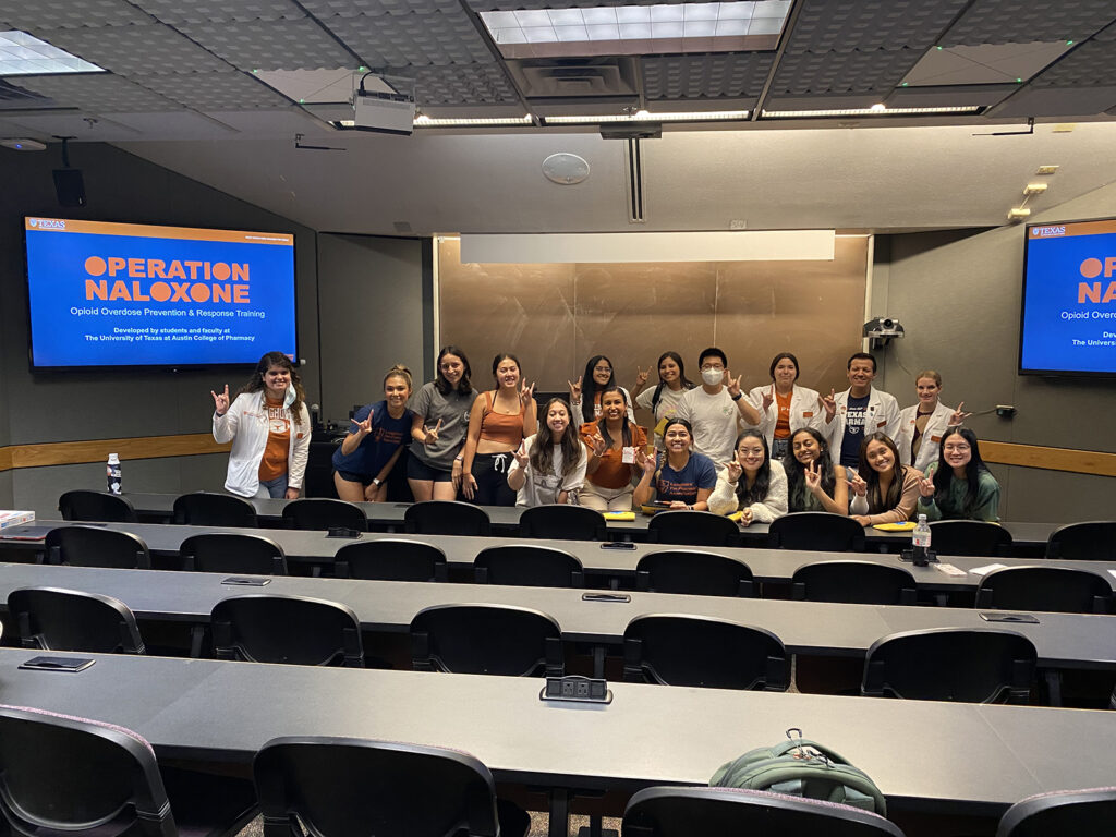 Classroom of students and a presentation on Naloxone.