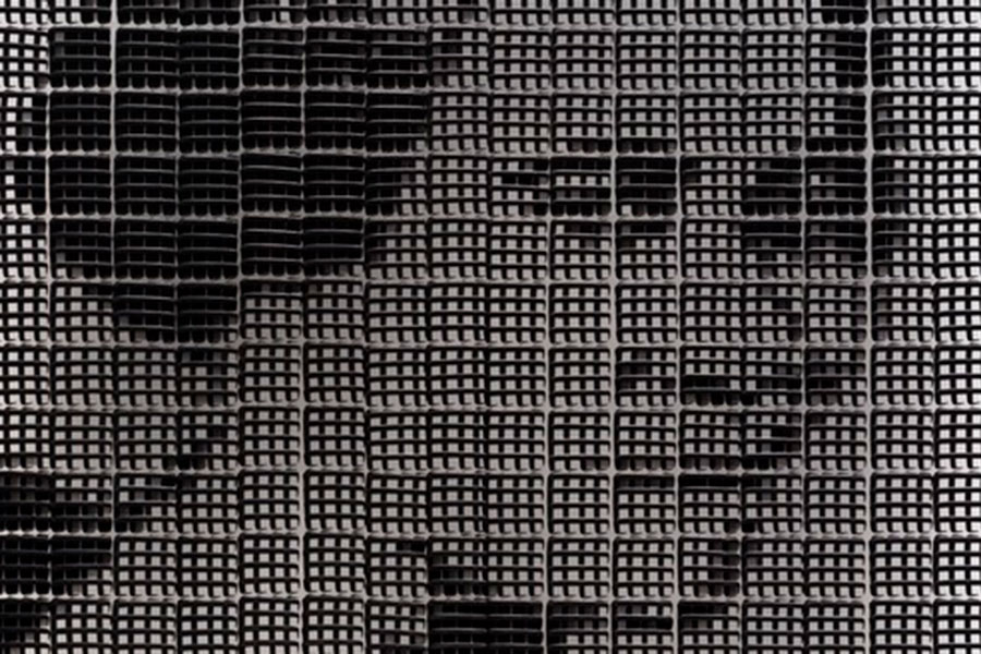 cropped detail of mosaic artwork of woman's face