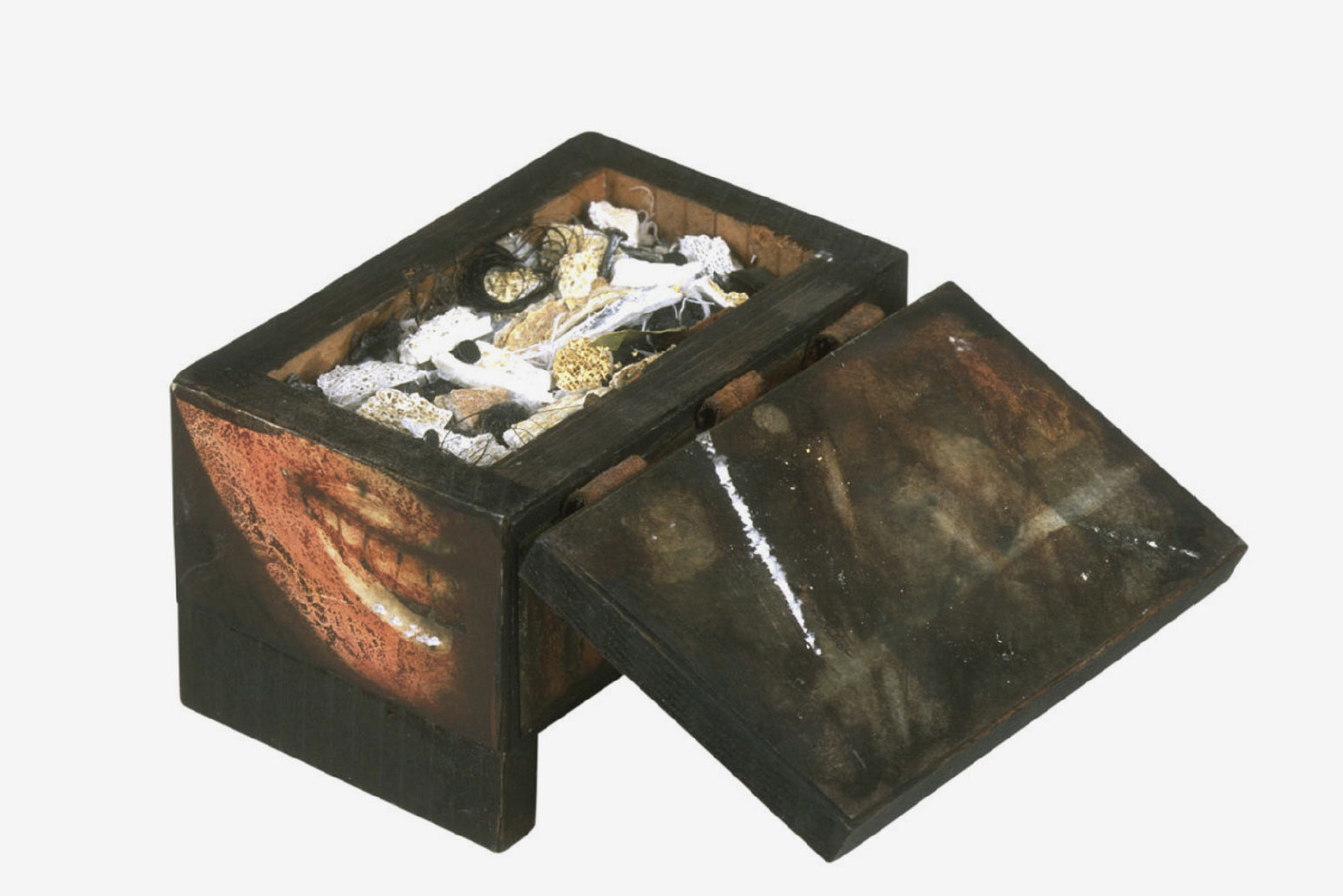 wooden chest with lid open containing unknown objects