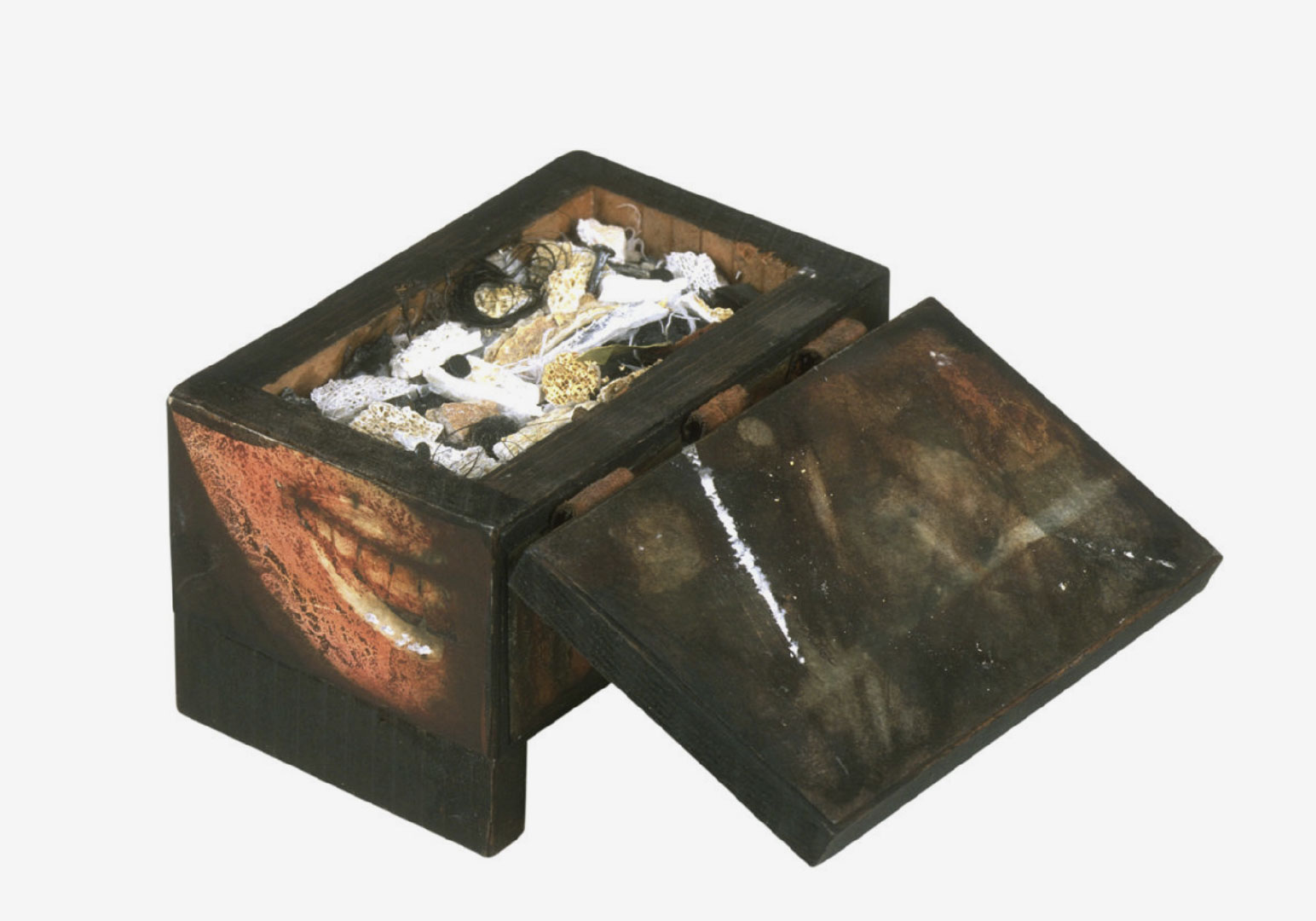 Box with lid open containing unknown objects