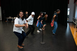 Photo of Miguel Marroquin leading a ballet folklorico workshop