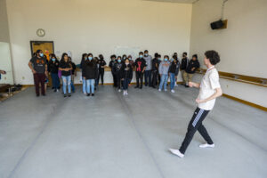 Photo of a UTeach Dance student leading a workshop at the symposium 