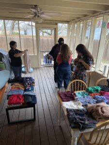 Students looking through donated clothes. 