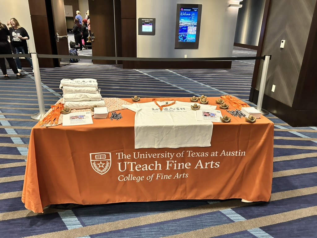 Collegiate Fair on Wednesday, January 8, 2025. Table with UTeach Fine Arts logo on tablecloth.