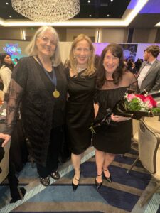 L to R: Mary Beth Kepper, Tina Curran, Denise Cochran; Mary Beth was previously inducted into the Hall of Fame) in ballroom for TDEA banquet.