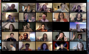 Virtual UTFA Celebration attendees holding up Hook 'Em