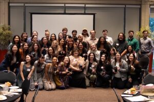 2023 UTeach Fine Arts Seniors holding their senior gifts at the UTeach Fine Arts Spring Celebration- group photo