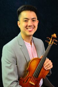 Matthew Chan headshot holding a violin.